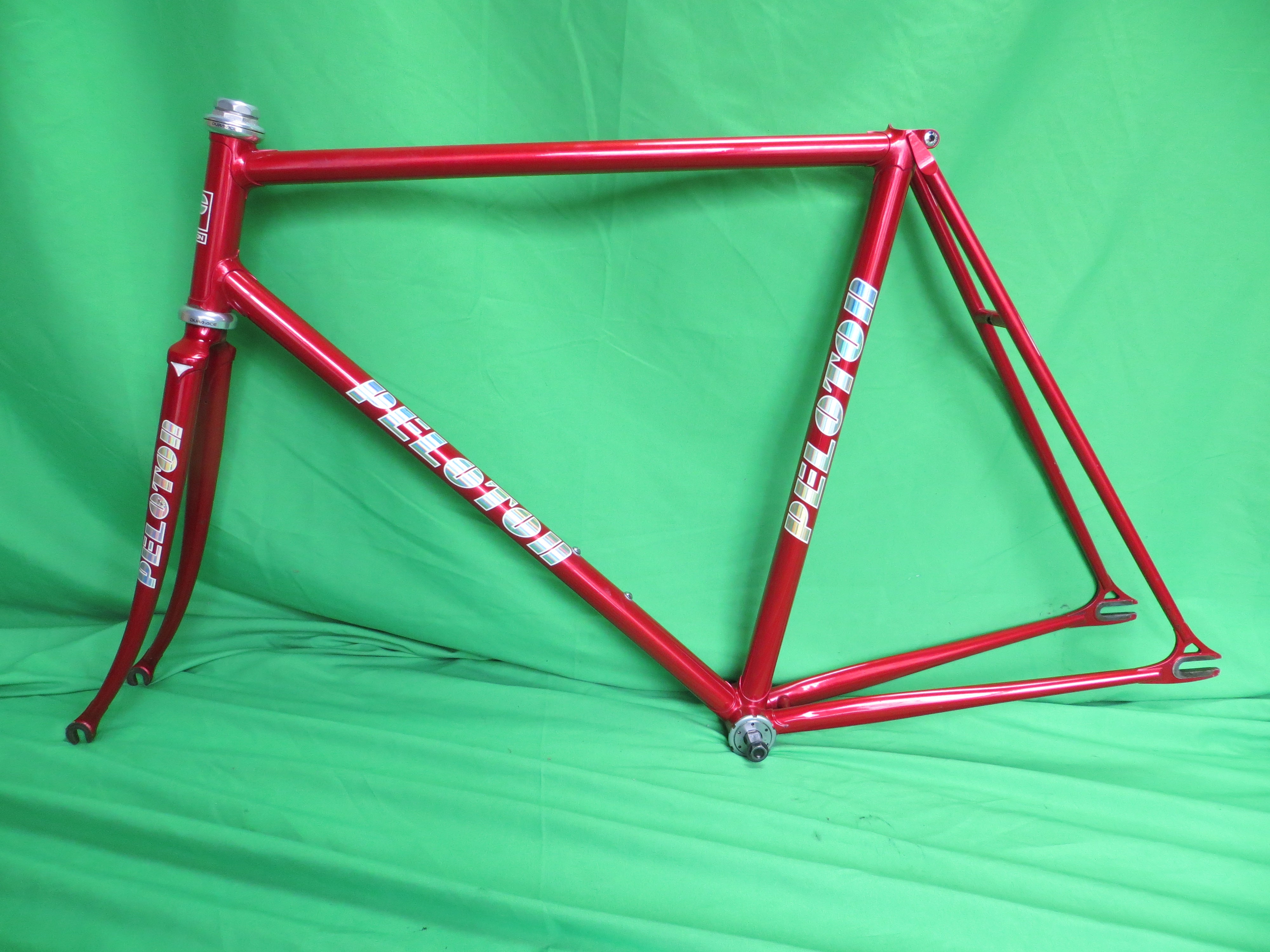 Peloton Drilled For Brakes // Red Metallic // 54.5cm